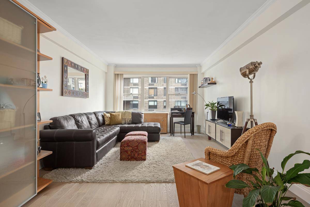 A MUST SEE ! Large fully renovated 1 bedroom apartment on a tranquil, tree lined street.