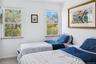 Bedroom featuring carpet flooring and baseboards