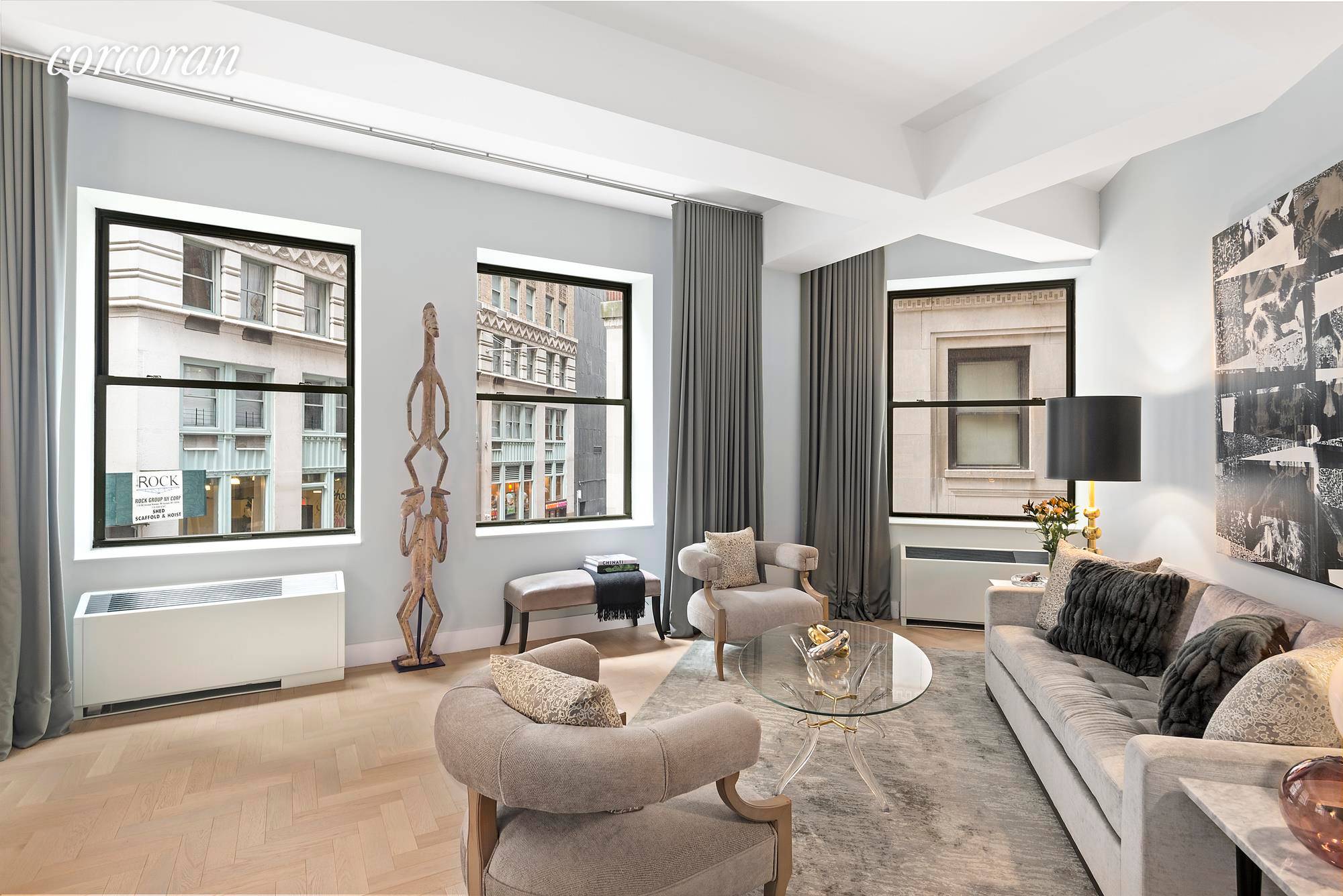 Perfectly perched over the corner of John and Gold Streets, this expansive 2 bedroom and 2 bath corner loft boasts soaring 11 foot beamed ceilings and refined modern finishes.