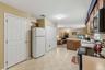 The pantry on the left side and washer/dryer on the right of the refrig-Super convenient