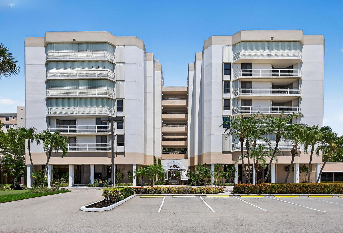Exterior view showcasing the distinctive architecture of this oceanfront Jupiter community