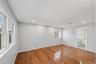 First Floor Primary Bedroom with wood-finish flooring, recessed lighting, and en-suite
