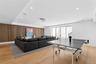 Rec room with wooden walls, recessed lighting, and light wood-style flooring