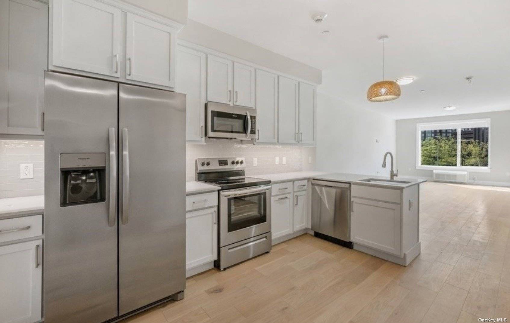 This light filled open concept floor plan offers stainless steel appliances, caesarstone countertops, custom cabinetry, in unit washer dryer, and rainfall showers.