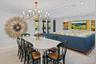 Dining room featuring a chandelier, light wood-style floors, built in shelves, recessed lighting, and ornamental molding