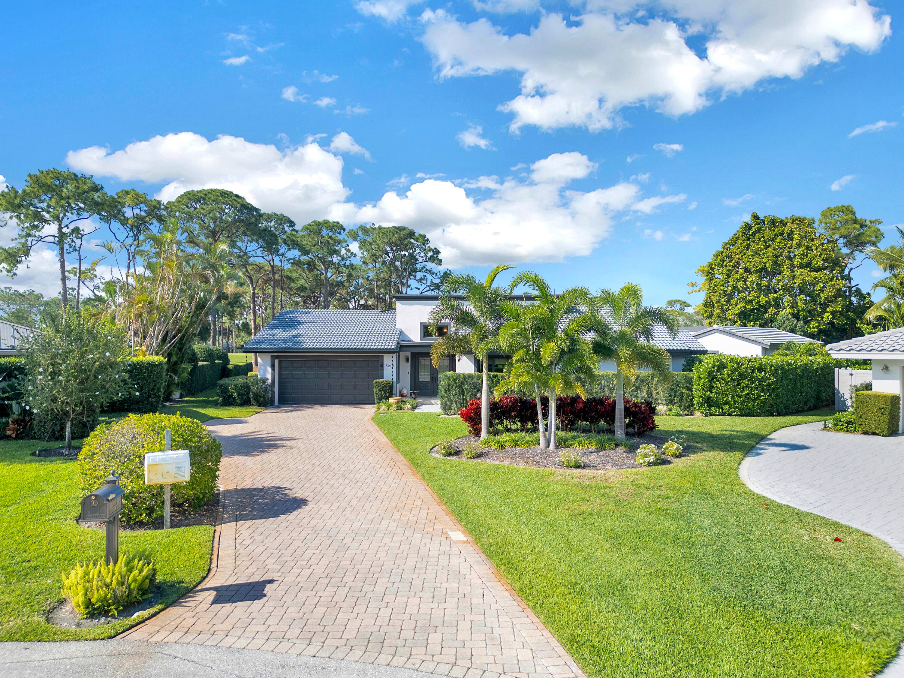 Nestled within the prestigious gated Seagate golf club community, this luxurious home captivates with its stunning design and unrivaled location along the 14th hole.
