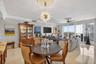 Beautiful sputnik chandelier, Emtek crystal door hardware throughout unit, counter seating at kitchen. Crown molding.