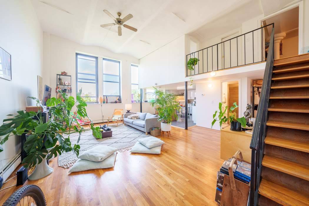 Presenting this exquisite Duplex Loft at Magnolia Mansion Lofts, drenched in natural light boasting over 13 high ceilings in the living room and expansive north facing oversized windows.