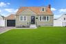 Welcome to 13 Maple Drive Lindenhurst. Lawn digitally enhanced.