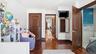 Bedroom featuring dark wood finished floors and crown molding