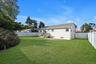 Back of property with a fenced backyard and a patio area