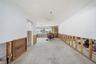 Extension of living room leading back to the family room.