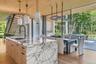 Open Concept Kitchen and Dining with seamless indoor/outdoor entertaining capturing water views