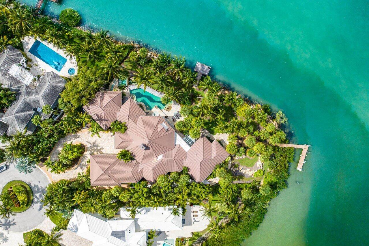 This spectacular waterfront estate is located on nearly an acre of land with 291 ft of waterfront.
