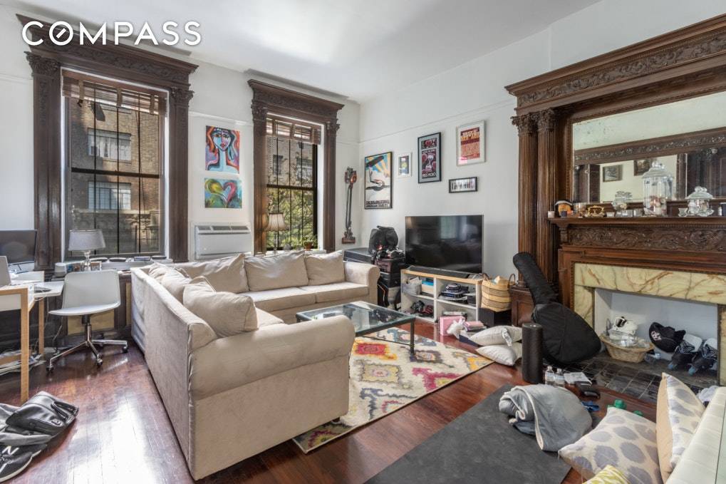 Lovely one bedroom apartment featuring original mahogany hand carved woodwork throughout, dramatic 12 ceilings and over sized windows overlooking lovely tree lined Gramercy Park.