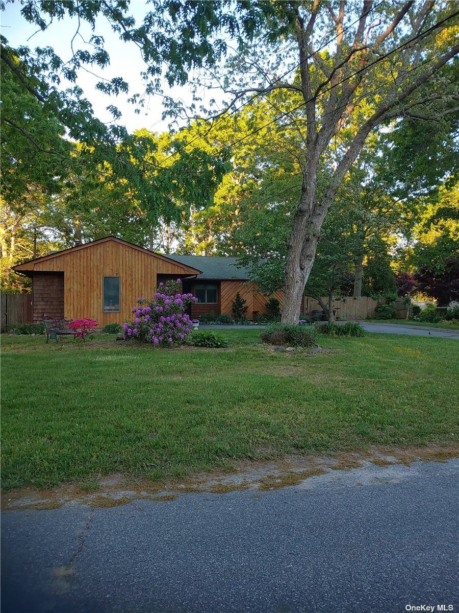 This Beautiful Wooden Ranch Is Located On A Half Acre Of Property In Shirley.