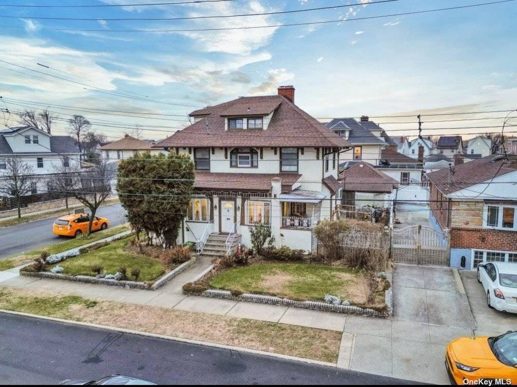 Charming stucco single family house in the heart of Queens Village on a spacious corner lot measuring 60 x 100 feet.