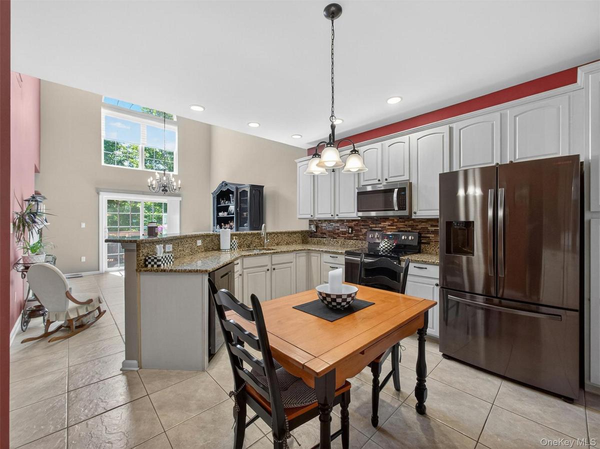 View from the updated chef-friendly kitchen through the dining room and out to the deck.