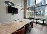 Home office featuring a wall of windows and wallpapered walls