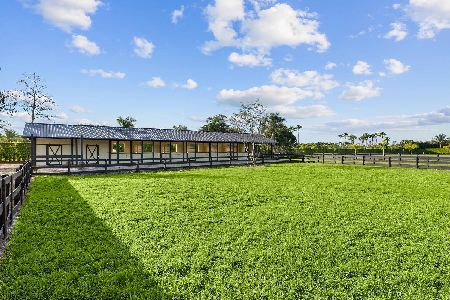 Gorgeous equestrian facility offering 6 stall open shed row barn for seasonal rent.