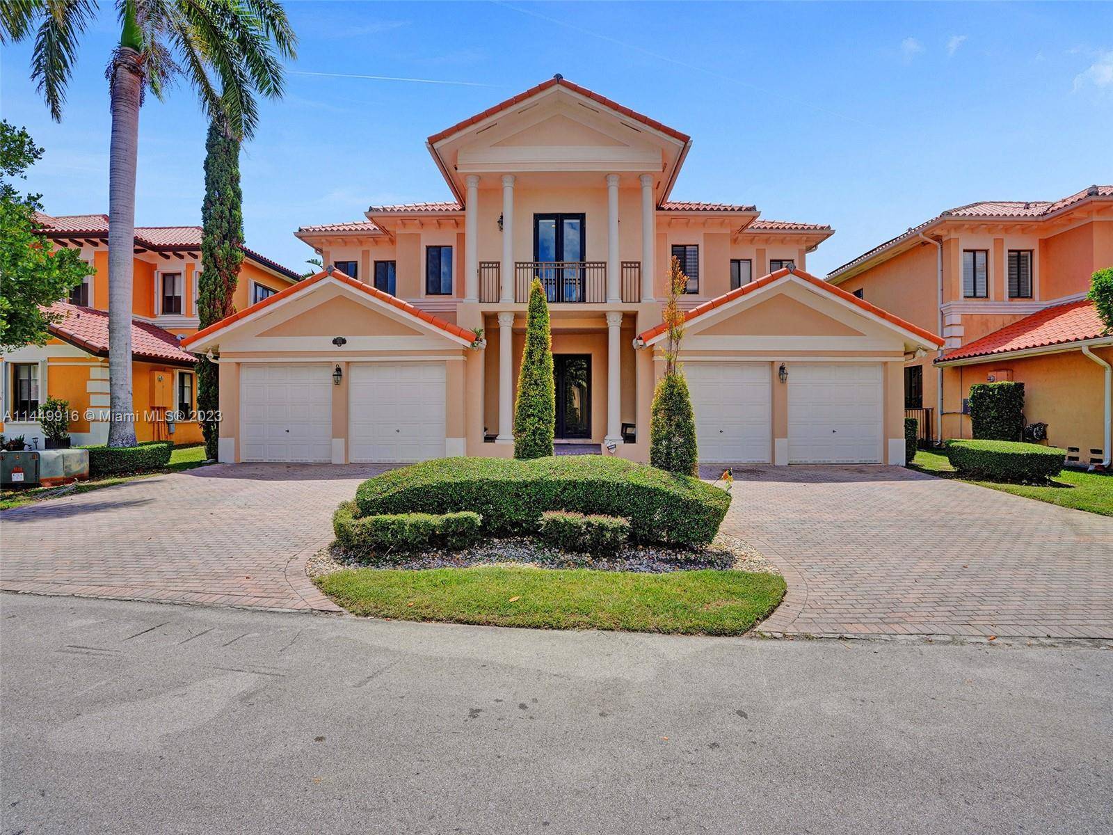 Elegant Two Story 5 Bed 4 Bath Home with Impressive Double Height Ceilings, Welcoming Foyer, Custom Pool Jacuzzi, and Expansive Deck in the Prestigious Gated Community of Cutler Cay.