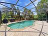 561 Harriswood Court heated pool with spa. Covered lanai with conservation view.