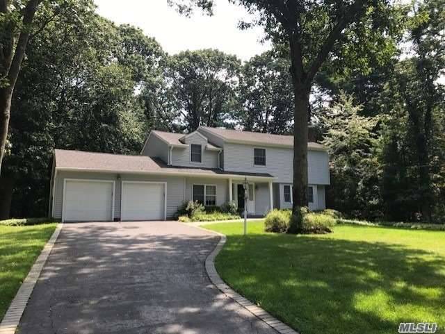 Beautiful Center Hall Colonial Loaded with Warmth and Charm, Located on Lovely Treed Setting, Hardwood Floors, Newer Vinyl Siding and Roofing 5 Yrs, Updated Gas HW Heating, Oversized Brick Lined ...