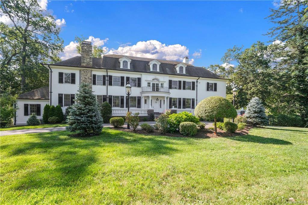 Majestic Colonial on 1. 77 park like acres in a prime Greenacres location.
