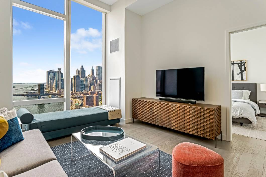 Stunning 1BR apartment with 12 foot ceilings and panoramic views available fully furnished.