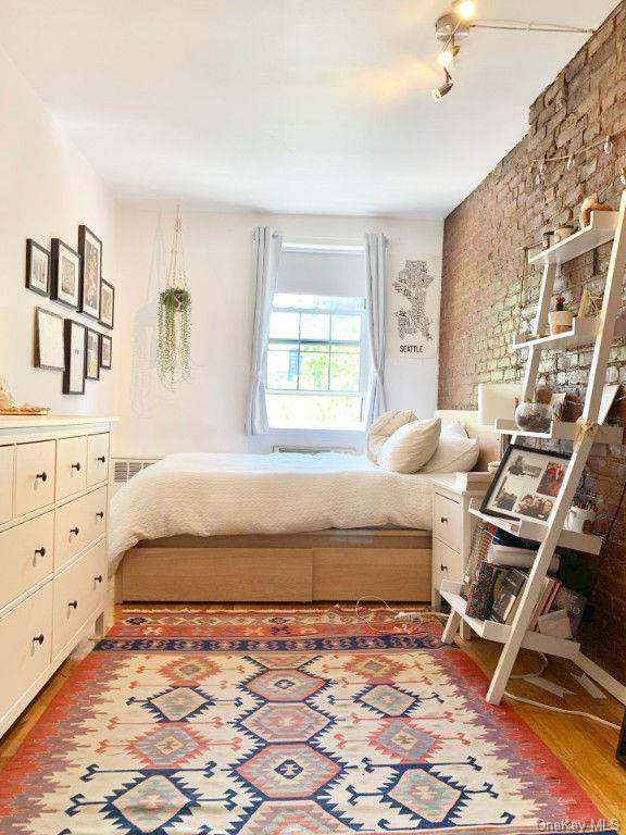 CHELSEA 2BR.. EXPOSED BRICK, SOUTHERN EXPOSURE, ON SITE LAUNDRY.