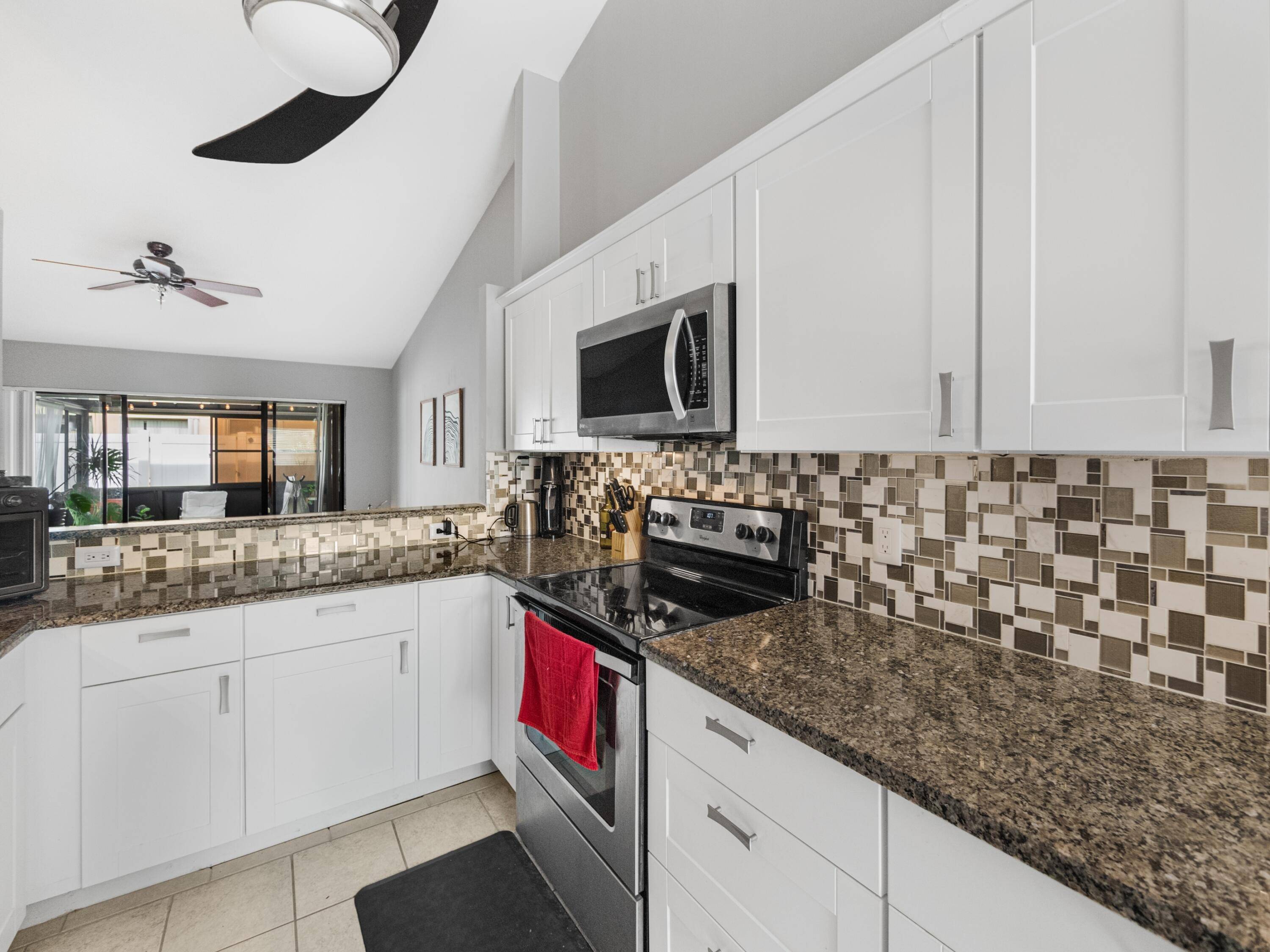 Unveil the epitome of comfort and convenience in West Palm Beach with this expansive, remodeled 2 bedroom, 2 bathroom townhome, complete with its own garage !