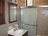 Bathroom featuring tile walls and vanity
