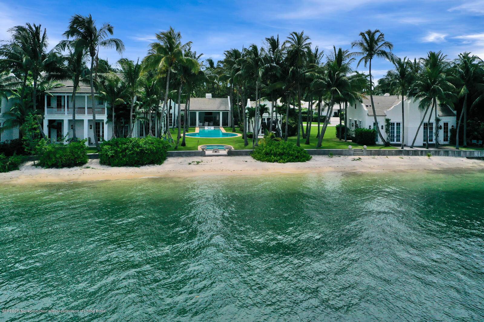 Sensational estate compound with morethan 250 feet of sandy beach on the Lake.