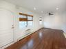 Spare room with recessed lighting, dark wood finished floors, ceiling fan, an AC wall unit, and a baseboard radiator
