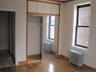 Closet featuring radiator heating unit