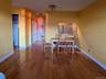 Dining area with sink and light wood-type flooring