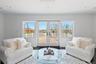 Living room with recessed lighting and wood finished floors