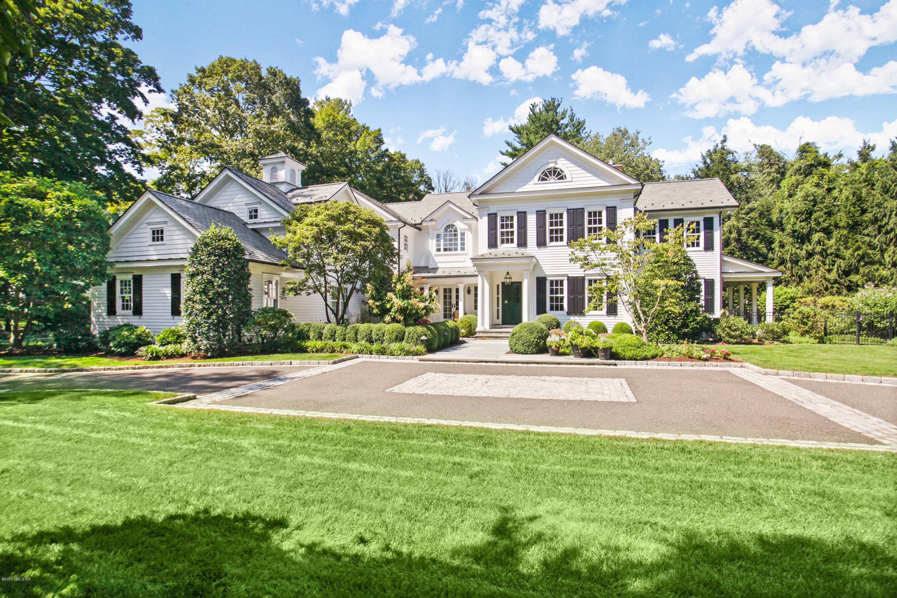 Quintessential New England Colonial on a beautiful one acre with a pool and spa.