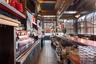 Community bar area with dark tile patterned flooring and butcher block countertops