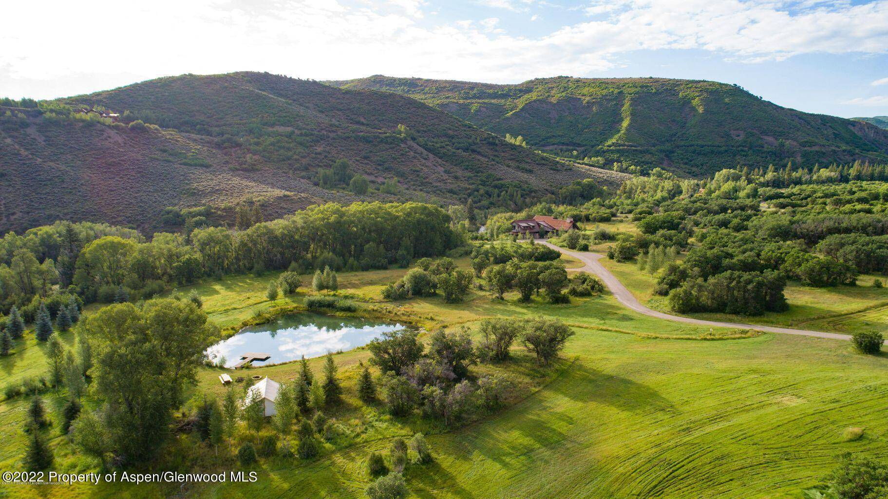 Stretching along the banks of Snowmass Creek, this 75 acre ranch property and spectacular mountain modern home is a slice of heaven on earth.