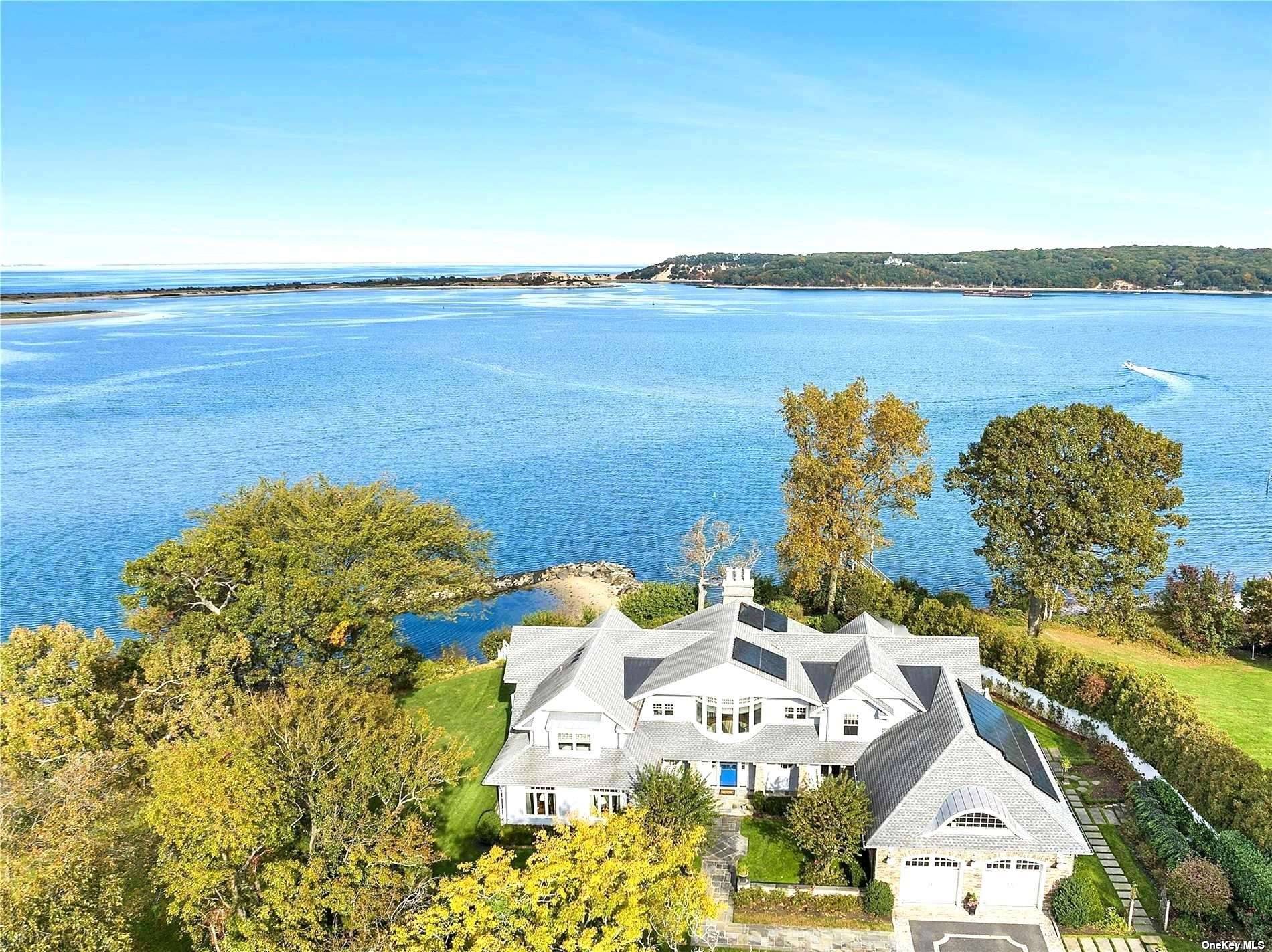 HERON'S COVE WATERFRONT Private and secluded, this spectacular waterfront property has stunning panoramic views from Setauket and Port Jefferson Harbors and the Long Island Sound to Connecticut.