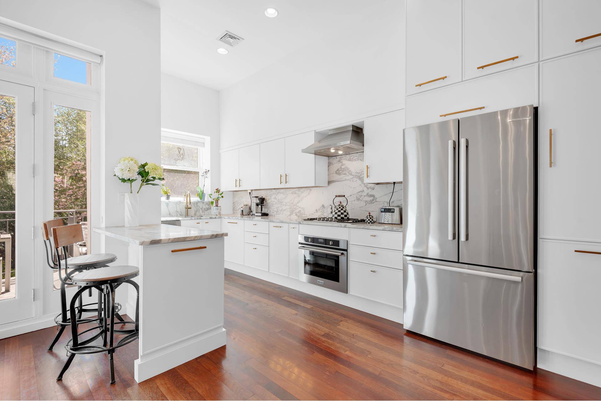 Experience the pinnacle of townhouse living within the heart of coveted Park Slope with this remarkable Garden Triplex.