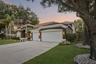 Generous 3 Car Garage and Mature Oaks