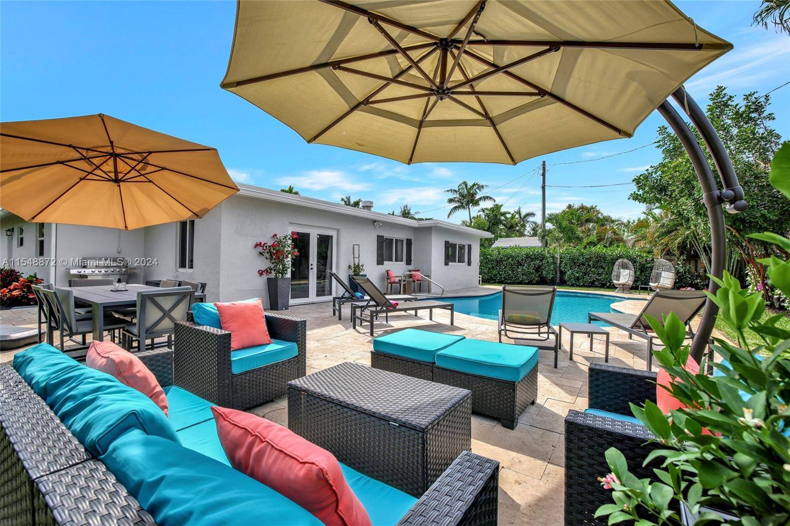 The perfect blend of comfort convenience in this charming pool home in the sought after North Corals.