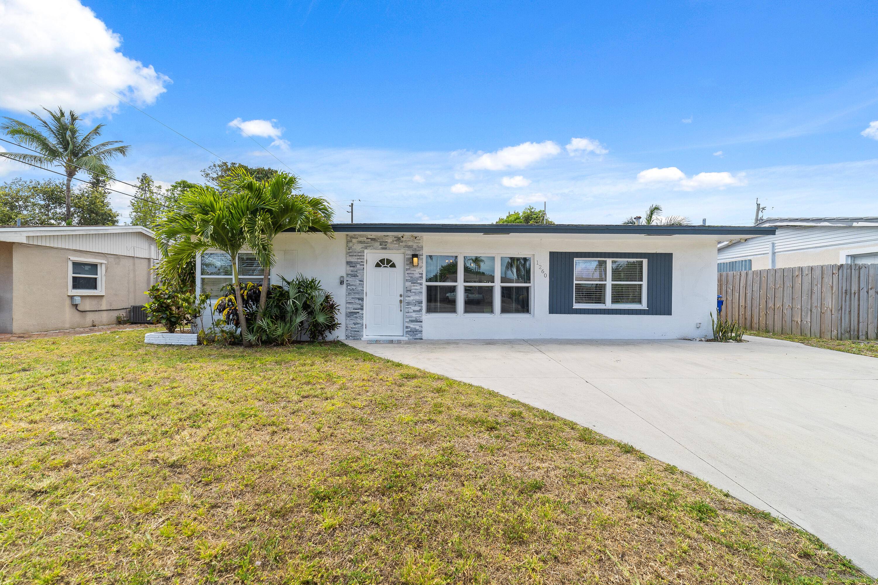 Welcome to this completely renovated home boasting a desirable split floor plan featuring 3 bedrooms and 2 bathrooms, all adorned with elegant porcelain tile flooring.