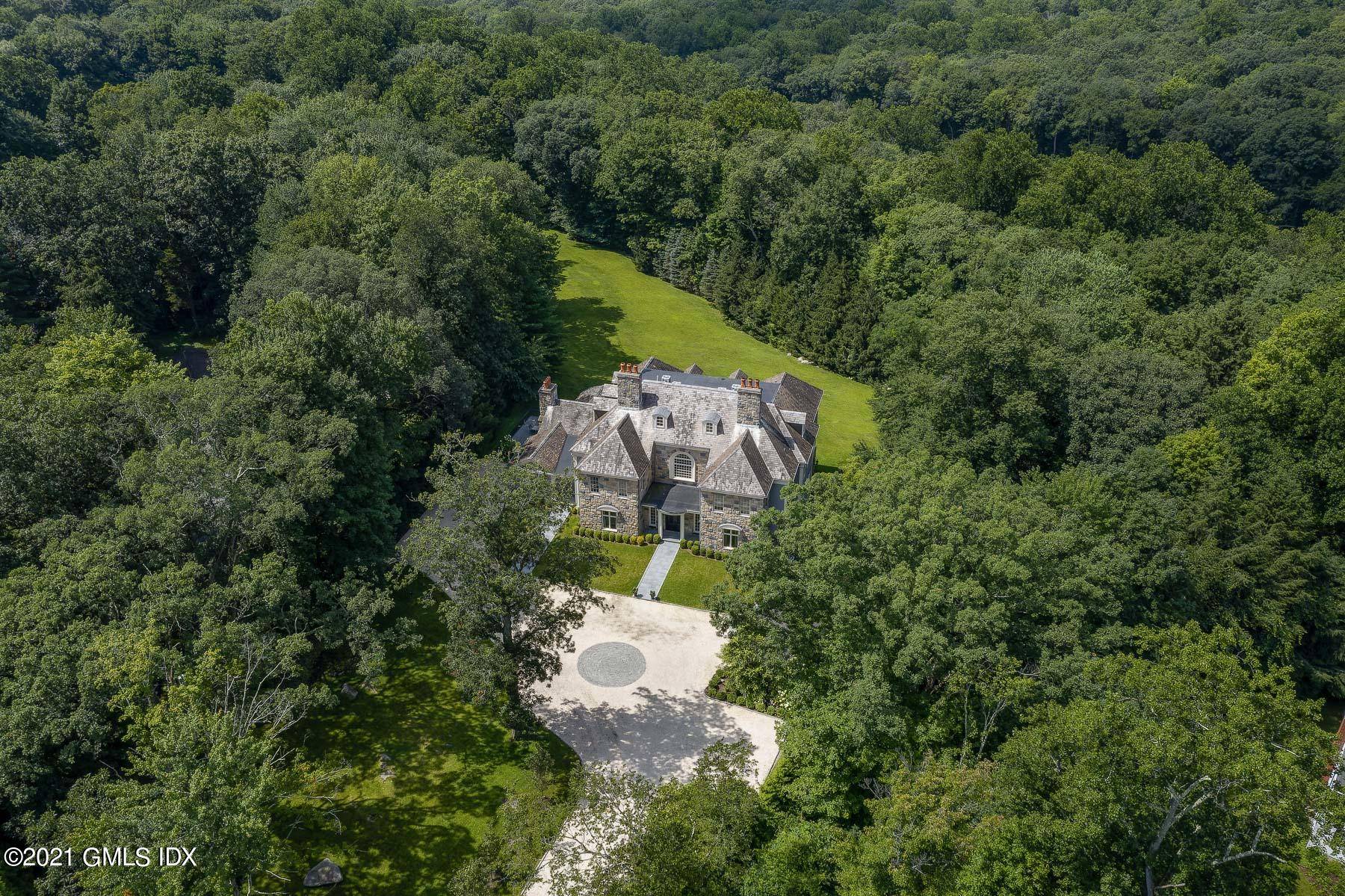 Secluded on 2 gated acres on a tranquil cul de sac, this distinguished Georgian colonial was finished with exquisite custom craftsmanship.