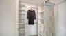 Main bedroom walk-in closet with built in closet system