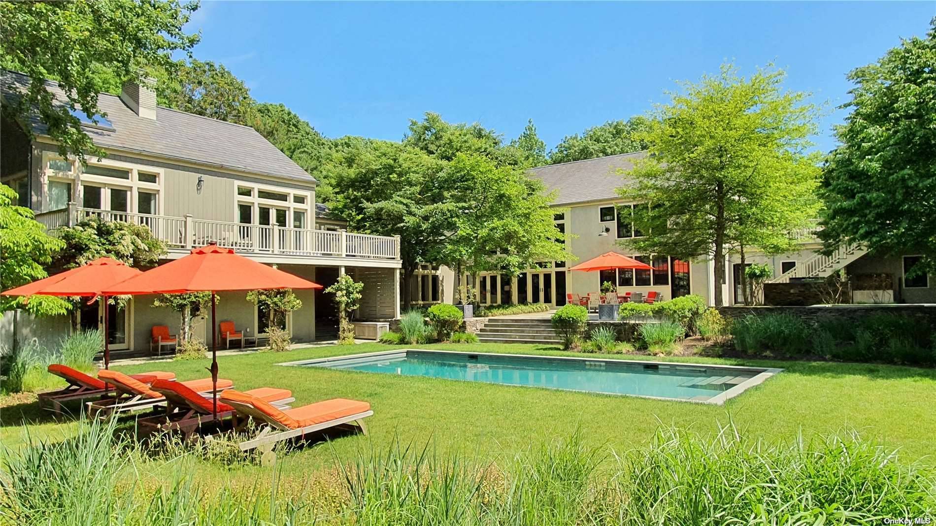 Minutes to East Hampton Village and beaches, down a long private drive on a beautifully landscaped 4 acre property is this extraordinary modern compound consisting of a main residence, very ...