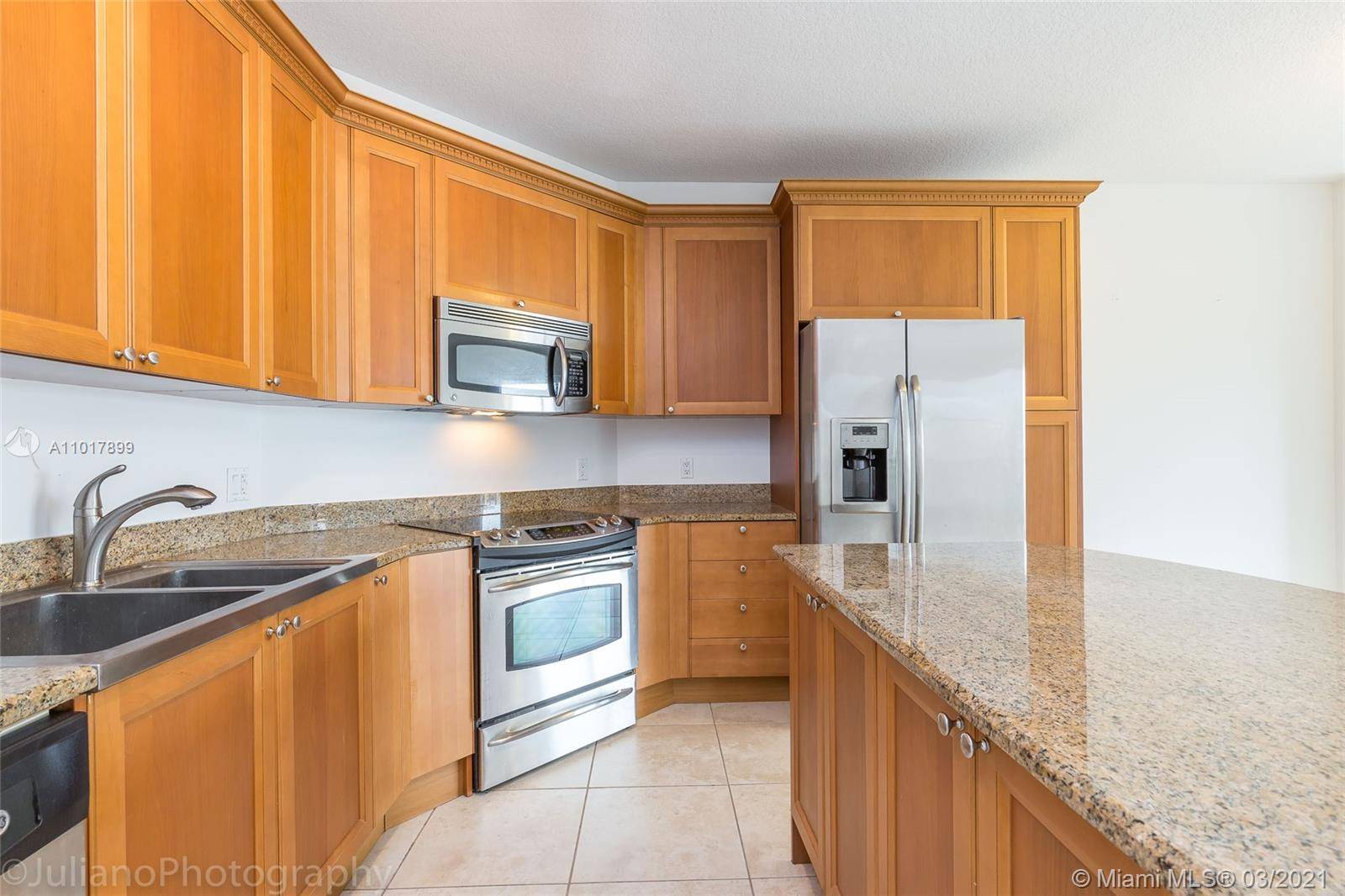 Marble floors, very spacious, wood cabinets, granite countertops, wood closets, washer dryer in unit.