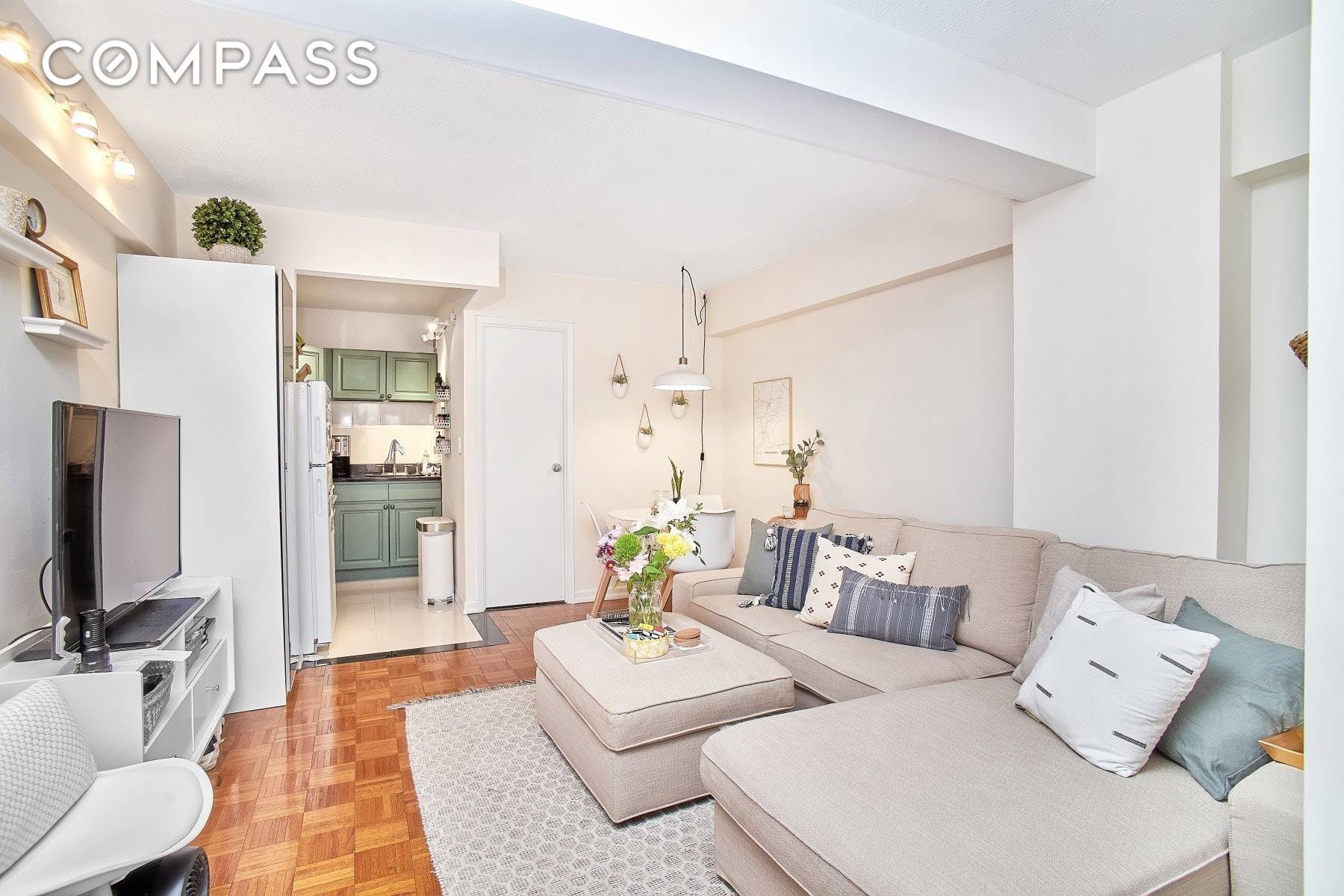 Sun floods this renovated two bedroom apartment with a PRIVATE PATIO, in an elevator building with a part time doorman in the heart of Nolita.